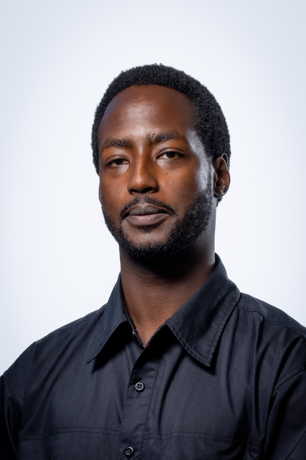 Portrait of John Nziza, Founding Partner and Chief Executive Officer